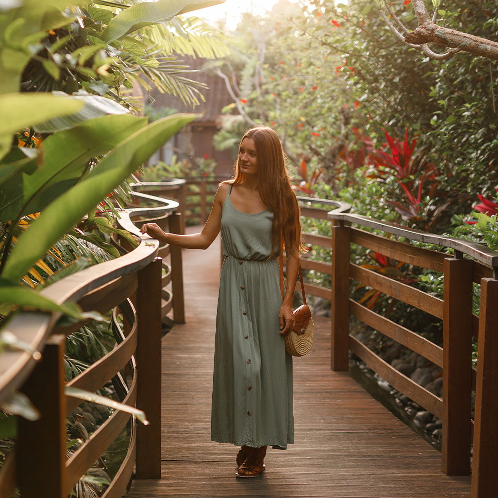 a person standing next to a tree